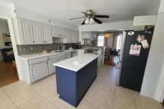 Interior kitchen cabinet painting with two tone color scheme by The Painting Group and Renovation