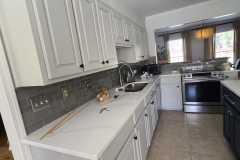 Interior kitchen cabinet painting with two tone color scheme by The Painting Group and Renovation