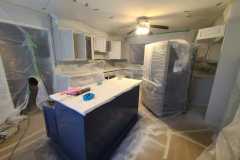 Interior kitchen cabinet painting  preparation and covering by The Painting Group and Renovation