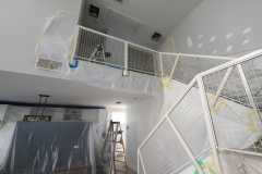 Interior painting preparation including covering, masking, and drywall repairs by The Painting Group and Renovation