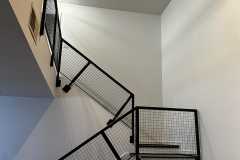 Interior metal railing painting with an enamel finish by The Painting Group and Renovation